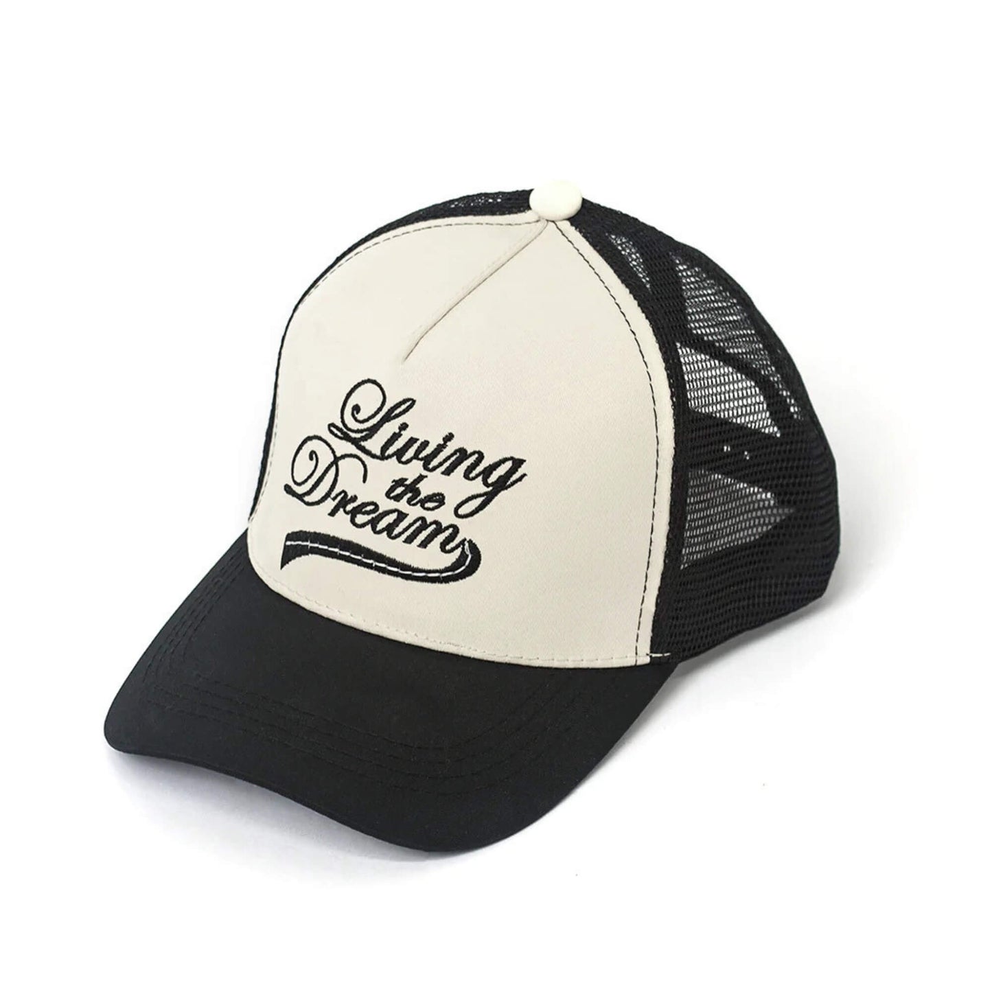 Black and white trucker hat with embroidered Living The Dream design