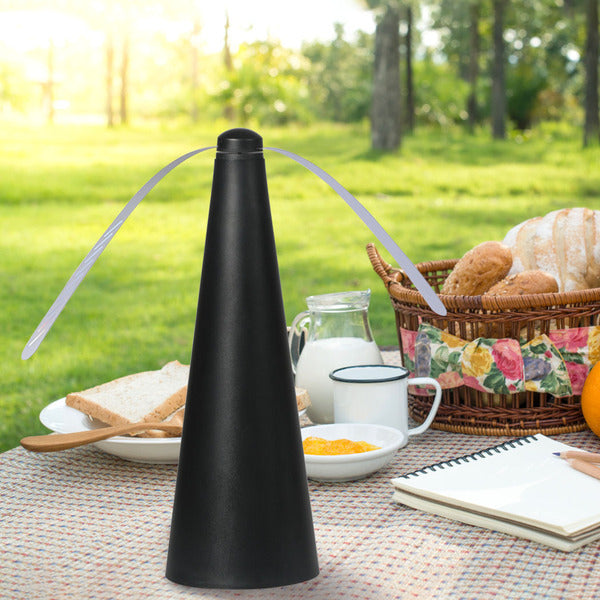 FlyFan Guard with two rotating arms to protect outdoor food and drinks from flies