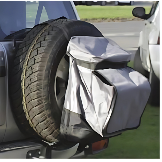 Dirty Devil Spare Wheel Rubbish Bag 64L attached to vehicle for outdoor storage and rubbish collection