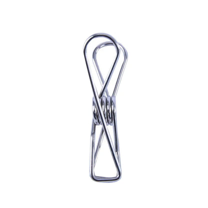 Metal clothes pin on a white background