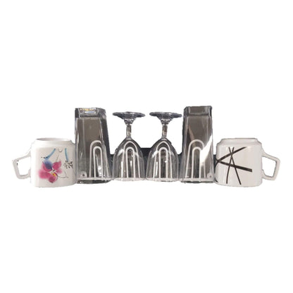 Set of silver wine glasses and mugs on a white background