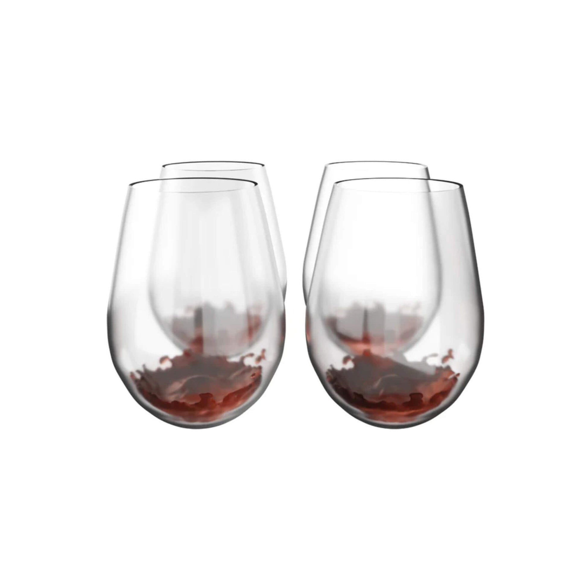 Two stemless wine glasses filled with red wine on a white background