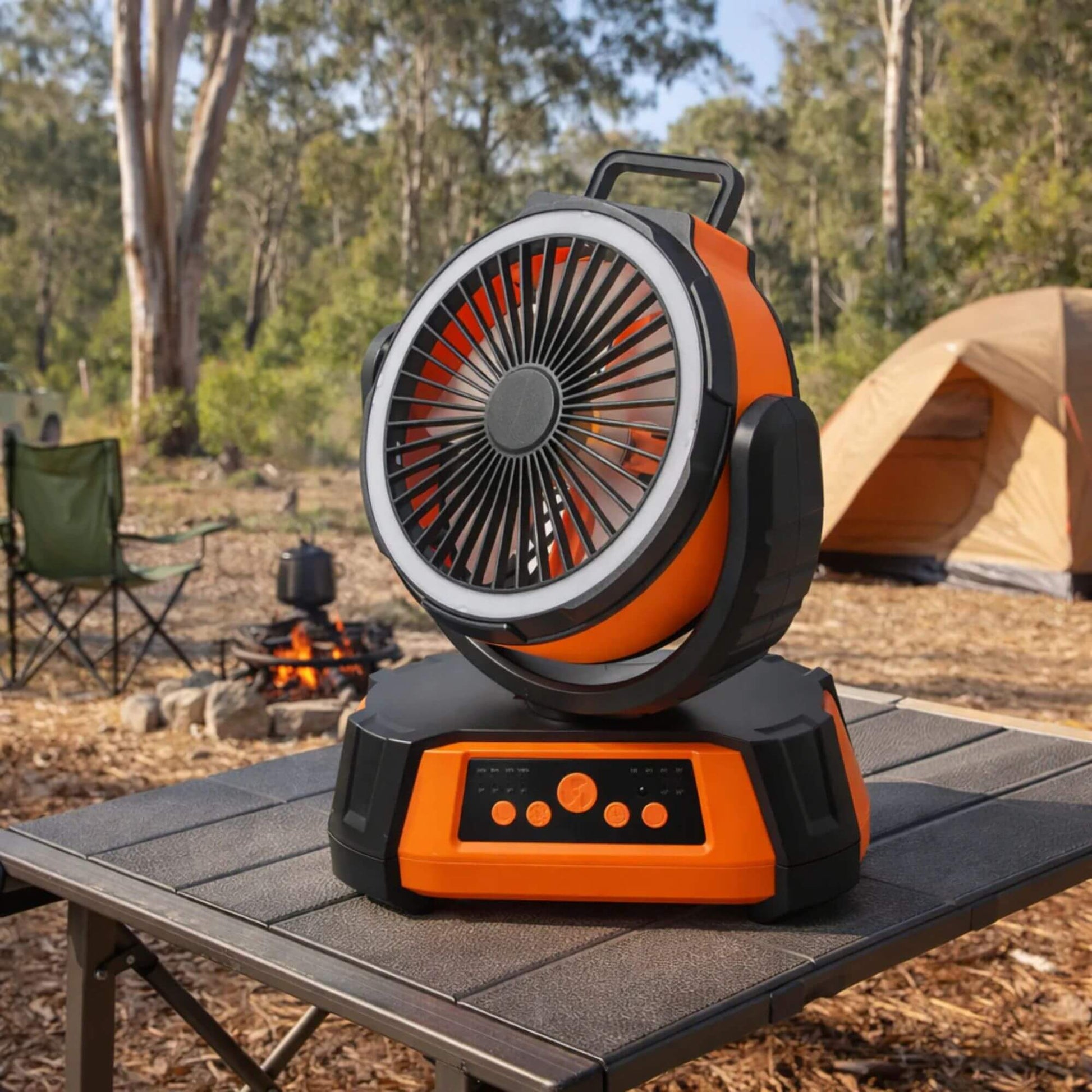Portable fan heater on a camping table with a campsite in the background