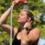 Portable camp shower with USB recharge, clip and suction pads for outdoor use